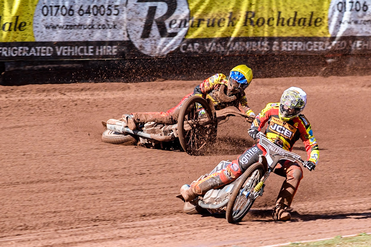 Leicester Lion Cubs' Sonny Springer  (Yellow) falls behind team mate Leicester Lion Cubs' Luke Crang (White) during the WSRA  National Development League match between Belle Vue Colts and Leicester Lion Cubs at the National Speedway Stadium, Manchester on Friday 29th March 2024. (Photo: Ian Charles | MI News)