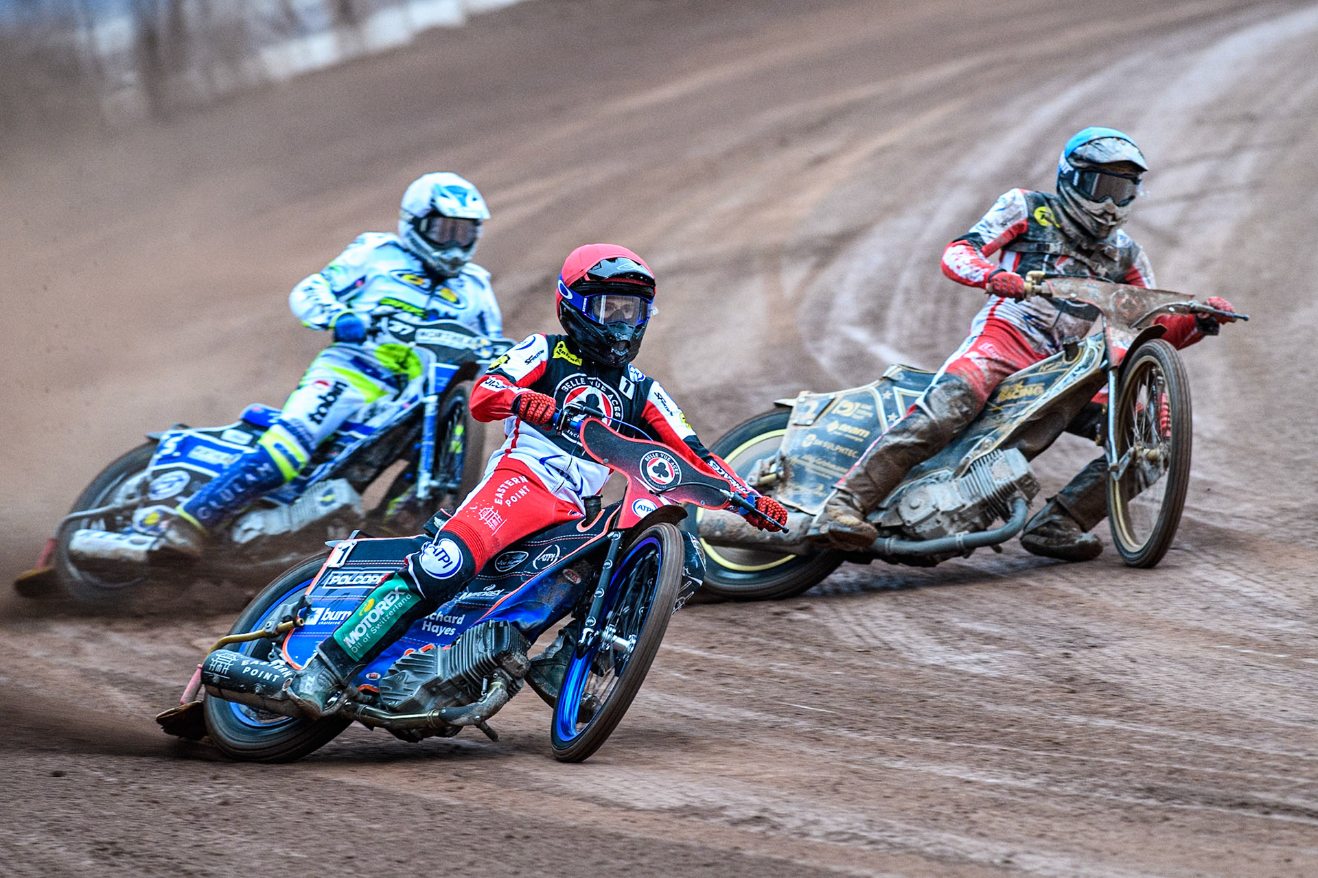 Belle Vue Aces' Brady Kurtz  in Red rides outside Belle Vue Aces' Norick Blodorn  in Blue with Oxford Spires' Chris Harris   in White behind during the Rowe Motor Oil Premiership match between Belle Vue Aces and Oxford Spires at the National Speedway Stadium, Manchester on Monday 22nd July 2024. (Photo: Ian Charles | MI News)