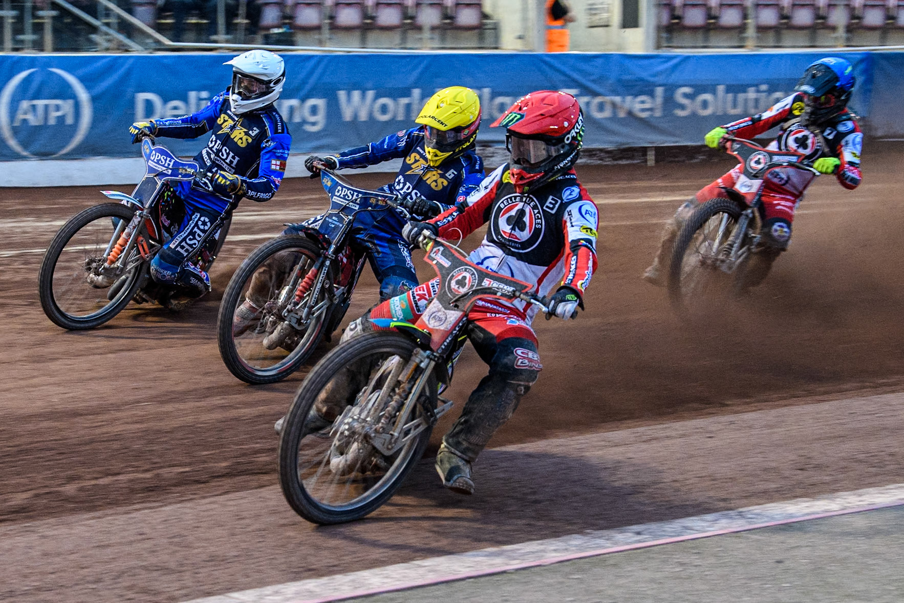 King Lynn Stars' Niels-Kristian Iversen in Red rides inside King Lynn Stars' Patryk Wojdylo in Yellow and King Lynn Stars' Niels-Kristian Iversen in White with Belle Vue Aces' Connor Bailey in Blue behind during the Rowe Motor Oil Premiership match between Belle Vue Aces and King's Lynn Stars at the National Speedway Stadium, Manchester on Monday 20th May 2024. (Photo: Ian Charles | MI News)