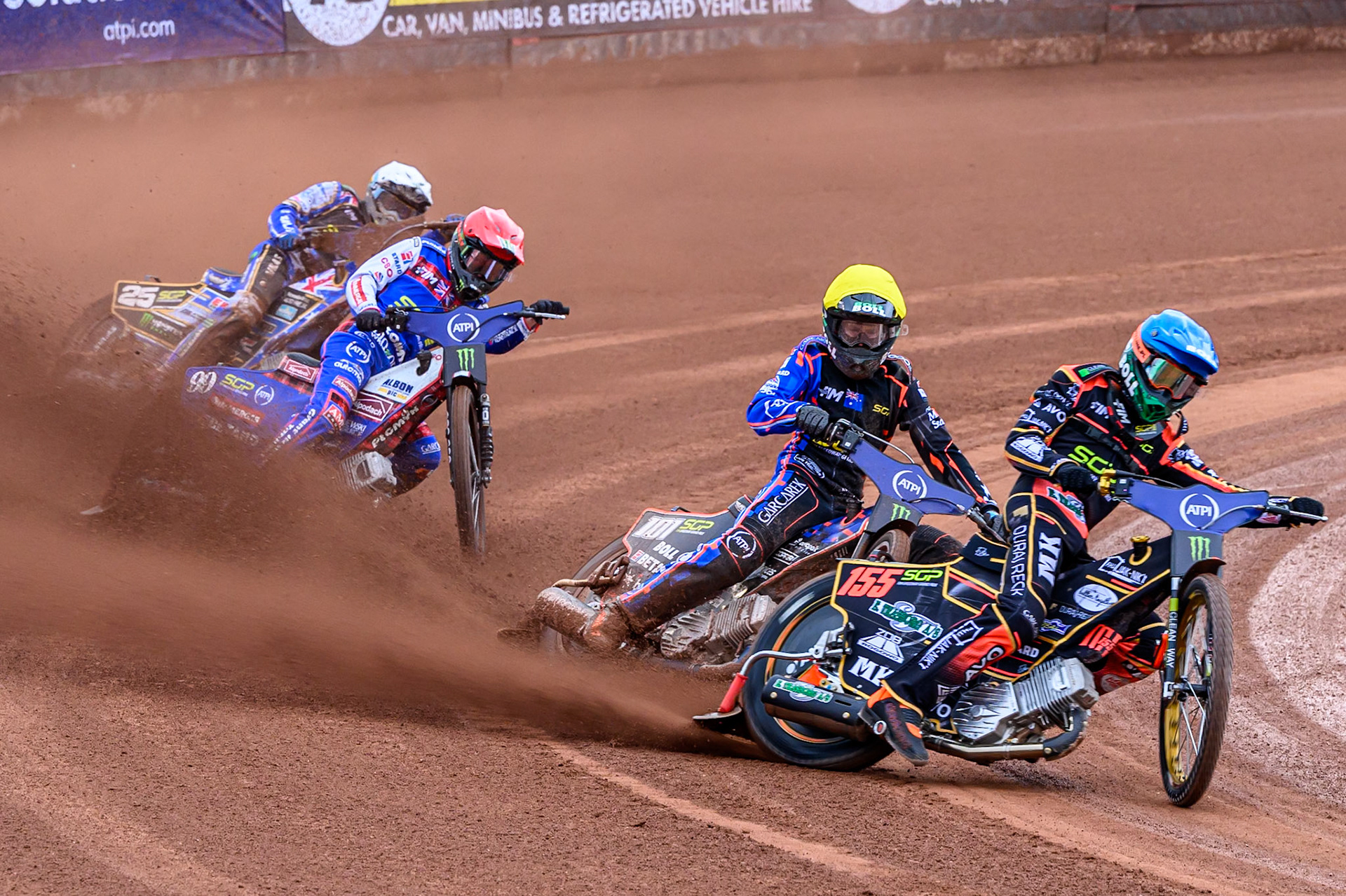 Mikkel Michelsen (155) of Denmark in Blue leading Brady Kurtz (101) of Australia in Yellow, Dan Bewley (99) of Great Britain in Red and Jack Holder (25) of Australia in White during the ATPI FIM Speedway Grand Prix Round 4 at the National Speedway Stadium, Manchester, on Friday 13th June 2025. (Photo: Ian Charles | MI News)