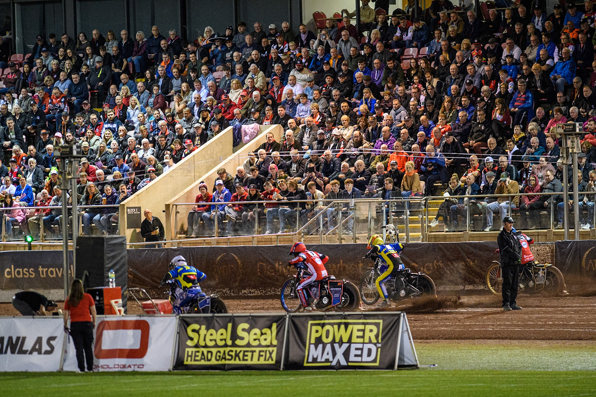 The riders leave the start in front of a huge crowd during the Rowe Motor Oil Premiership Play Off Semi Final 2, 1st Leg match between Belle Vue Aces and Sheffield Tigers at the National Speedway Stadium, Manchester on Monday 16th September 2024. (Photo: Ian Charles | MI News)