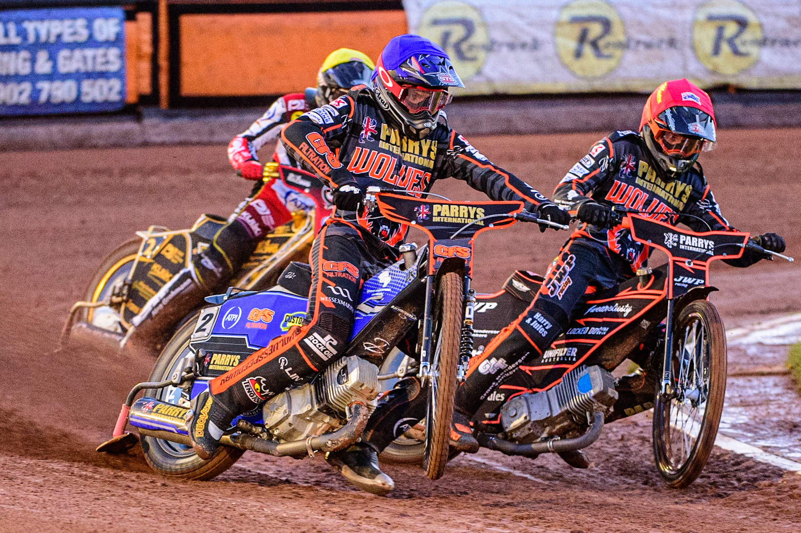 Steve Worrall (Blue) picks up some drive outside Sam Masters  (Red) with Norick Blodorn  (Yellow) behind during the SGB Premiership Knock Out Cup Quarter Final 1st Leg between Wolverhampton Wolves and Belle Vue Aces at Monmore Green Stadium, Wolverhampton on Monday 10th April 2023. (Photo: Ian Charles | MI News)