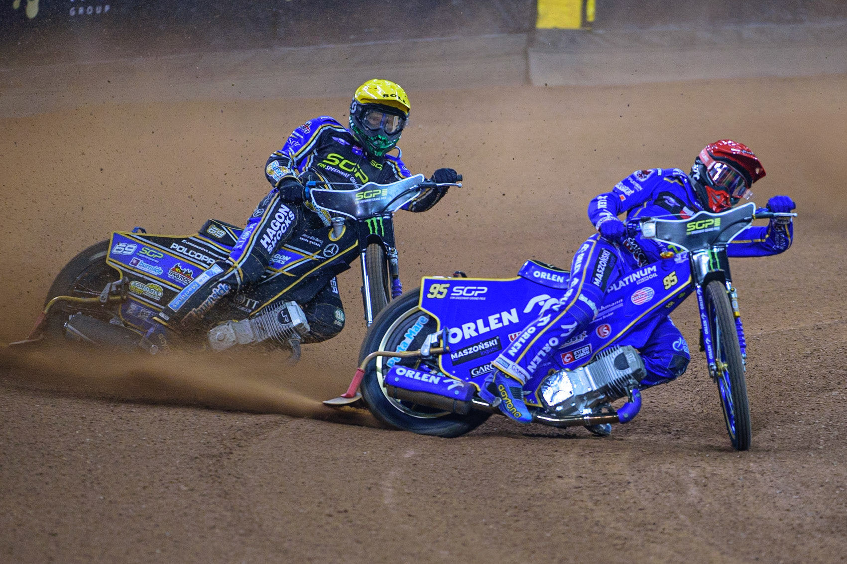 Bartosz Zmarzlik (95) (Red) leads Jason Doyle (69) (Yellow) during the FIM  Speedway Grand Prix of Great Britain at the Principality Stadium, Cardiff on Saturday 13th August 2022. (Credit: Ian Charles | MI News