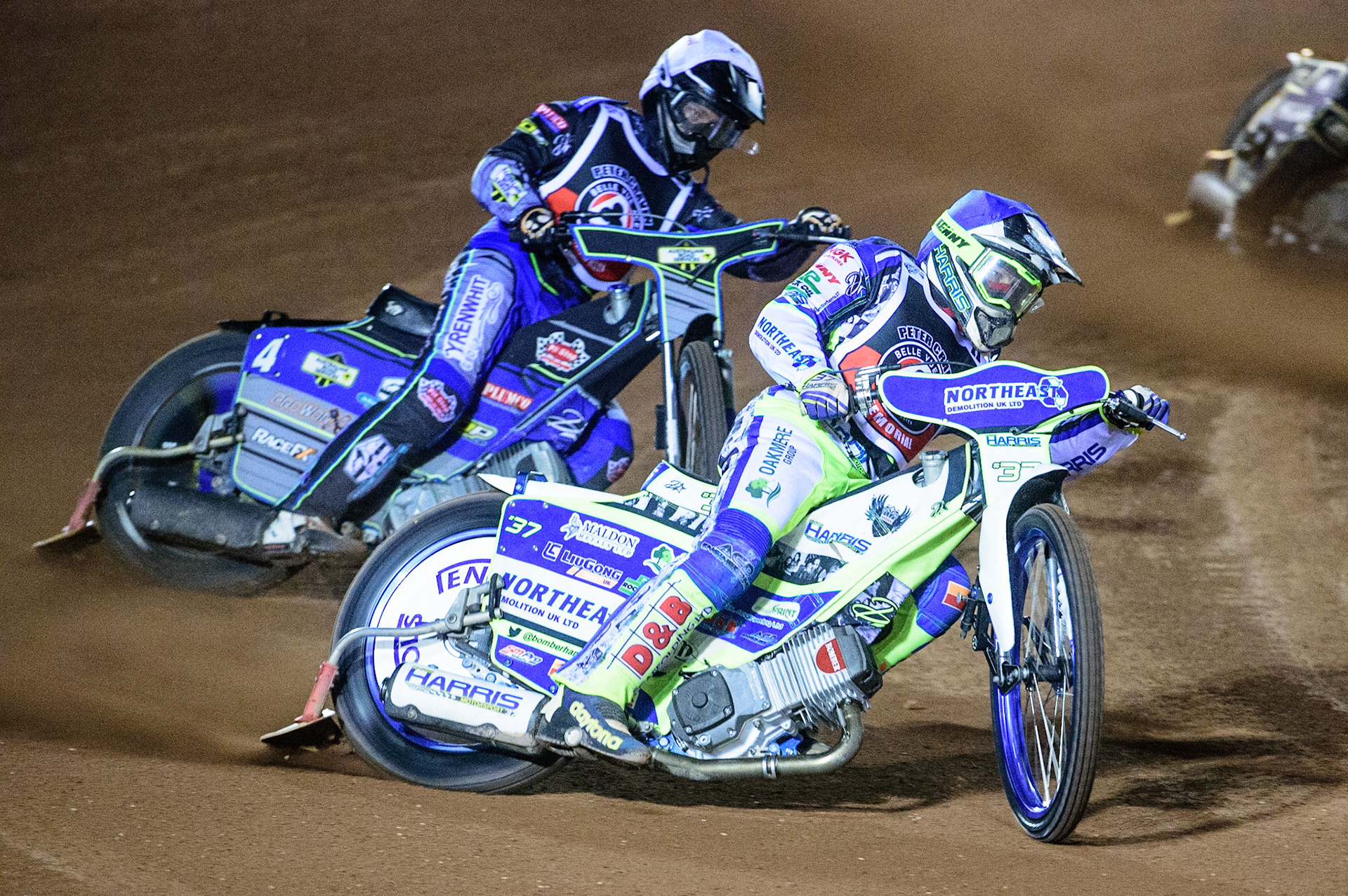 MANCHESTER, UK. OCT 23RD  Chris Harris  (Blue) leads Ryan Douglas  (White) during the Peter Craven Memorial Trophy event at the National Speedway Stadium, Manchester on Saturday 23rd October 2021. (Credit: Ian Charles | MI News)