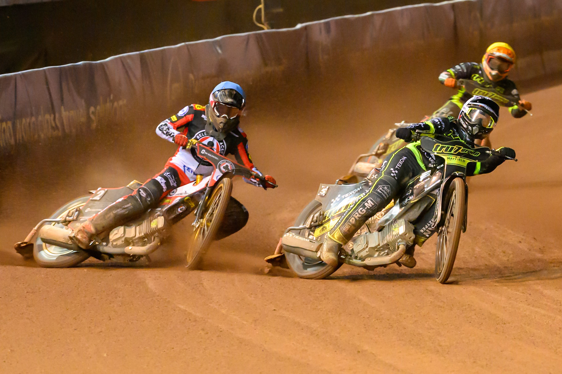 Tobias Musielak of Ipswich Witches in White on the inside of Norick Blödorn of Belle Vue Aces in Blue  Kevin Juul Pedersen of Ipswich Witches in Yellow  behind during the Rowe Motor Oil Premiership Play Off Semi Final 2nd leg match between Belle Vue Aces and Ipswich Witches at the National Speedway Stadium, Manchester on Monday 28th September 2026. (Photo: Ian Charles | MI News)