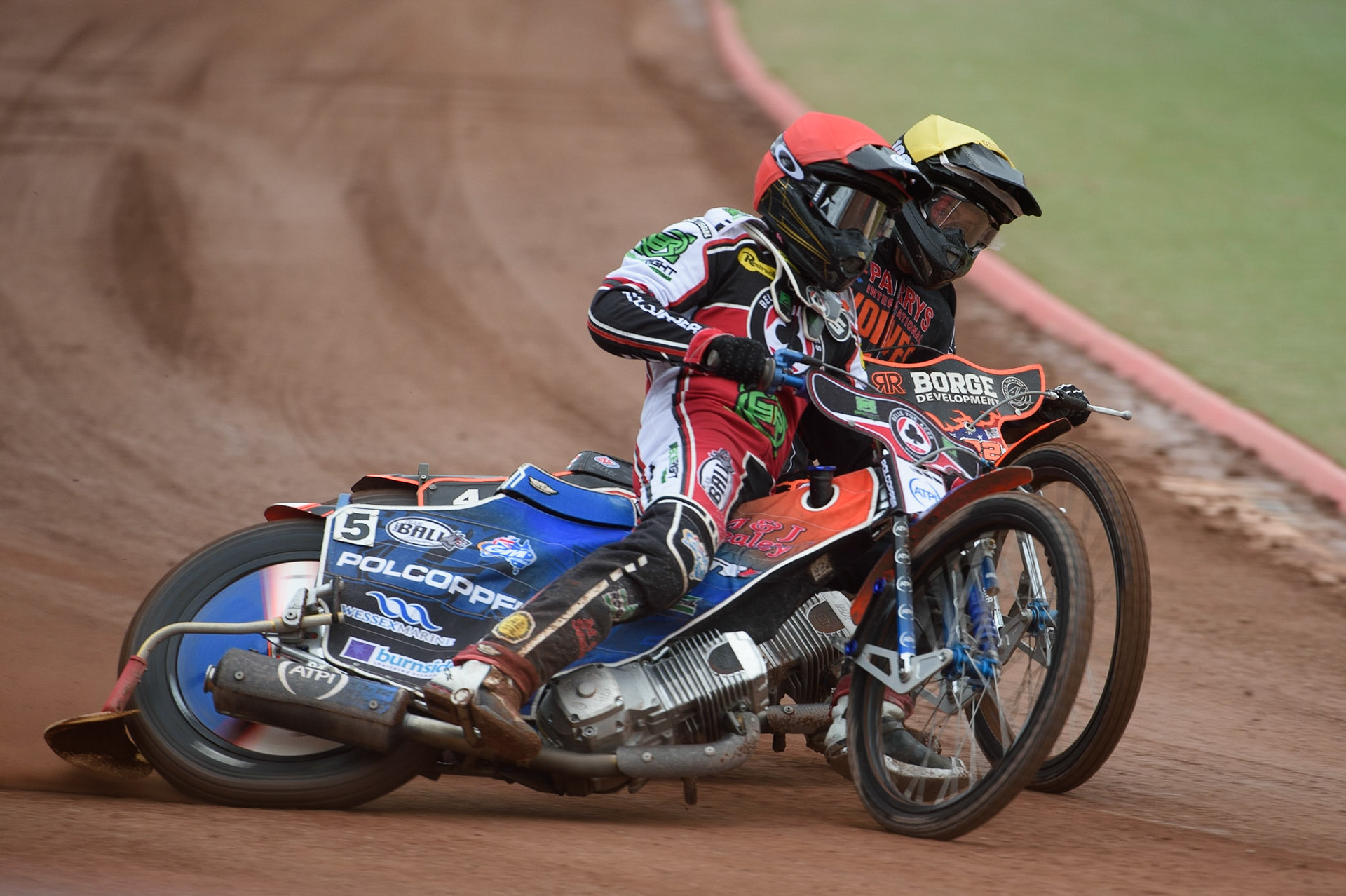 MANCHESTER, UK. AUGUST 30TH Brady Kurtz  (Red) and Luke Becker  (Yellow) battle it out during the SGB Premiership match between Belle Vue Aces and Wolverhampton Wolves at the National Speedway Stadium, Manchester on Monday 30th August 2021. (Credit: Ian Charles | MI News)