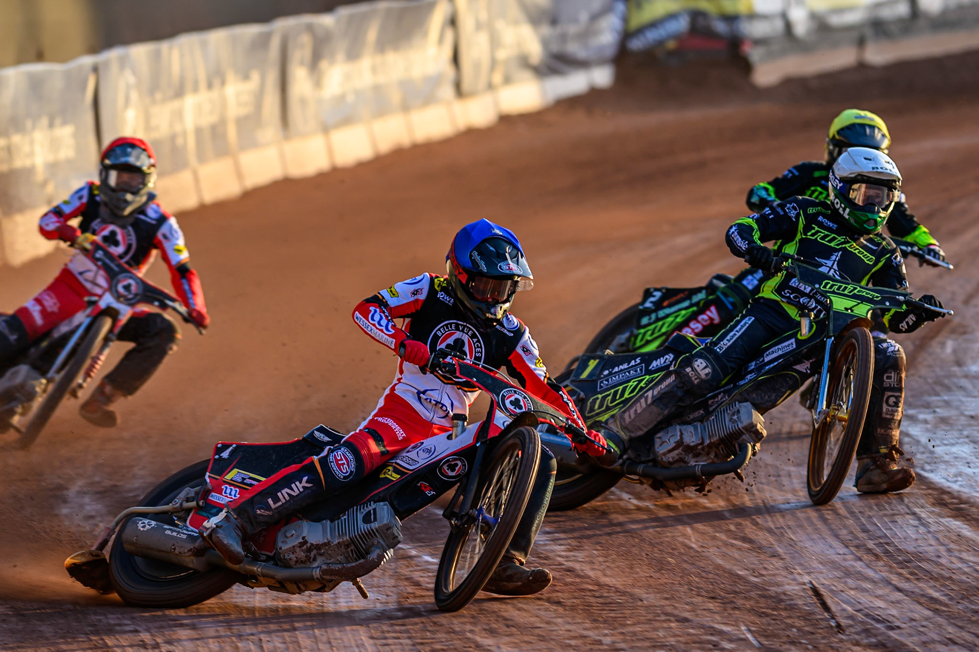 Zach Cook of Belle Vue Aces  in Blue leading Jason Doyle of Ipswich Witches  in White, Danny King of Ipswich Witches  in Yellow and Norick Blödorn of Belle Vue Aces  in Red during the Rowe Motor Oil Premiership match between Belle Vue Aces and Ipswich Witches at the National Speedway Stadium, Manchester on Monday 4th August 2025 (Photo: Ian Charles | MI News)