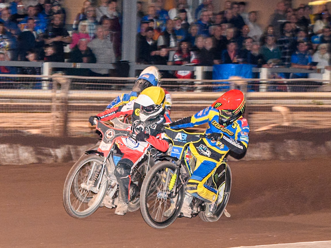 Belle Vue Aces' Antti Vuolas  in Yellow leading Sheffield Tigers' Chris Holder  in Red and Belle Vue Aces' Jaimon Lidsey  in White during the Rowe Motor Oil Premiership match between Sheffield Tigers and Belle Vue Aces at Owlerton Stadium, Sheffield on Monday 26th August 2024. (Photo: Ian Charles | MI News)