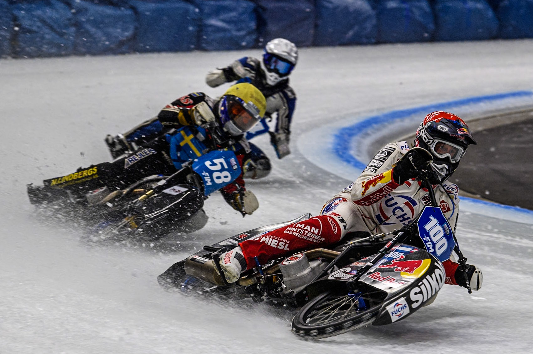 Austria's Franz Zorn (100) (Red) leads  Sweden's Stefan Svensson (58) (Yellow) and Finland's Max Koivula (24)  (White) during the FIM Ice Speedway Gladiators World Championship Final 1 at the Max-Aicher-Arena, Inzell on Saturday 23 March 2024. (Photo: Ian Charles | MI News)