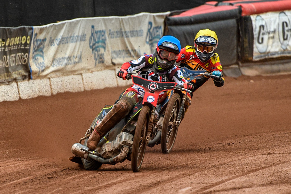 Tom Brennan (Blue) leads  Jake Allen (Yellow) during the Sports Insure Premiership match between Belle Vue Aces and Leicester Lions at the National Speedway Stadium, Manchester on Monday 28th August 2023. (Photo: Ian Charles | MI News)