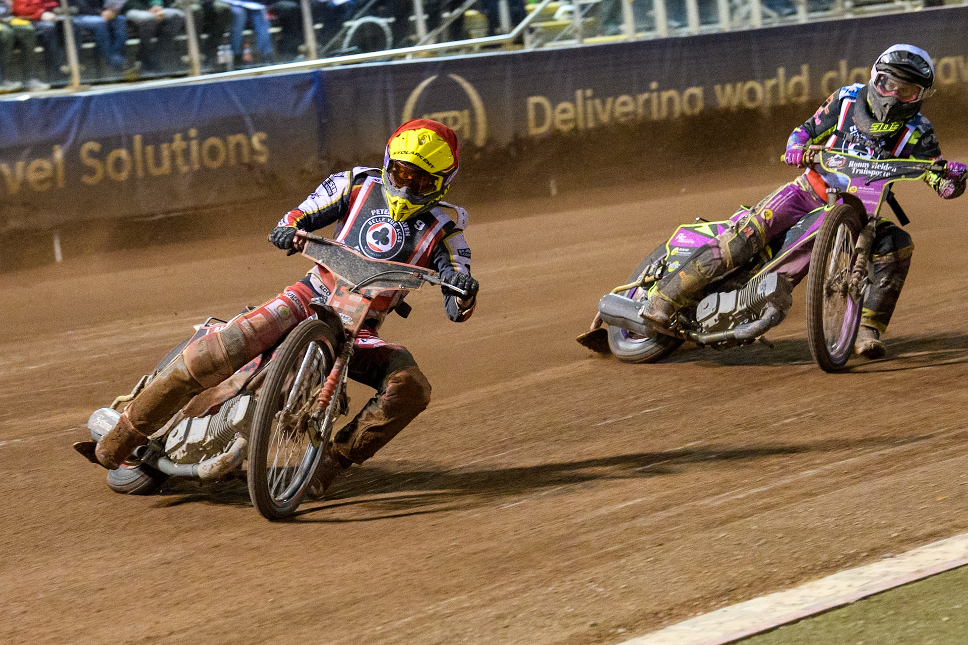 Poland's Patryk Wojdylo (Red) leads  Germany's Celina Liebmann (White) during the Peter Craven Memorial Trophy meeting at the National Speedway Stadium, Manchester on Monday 18th March 2024. (Photo: Ian Charles | MI News)