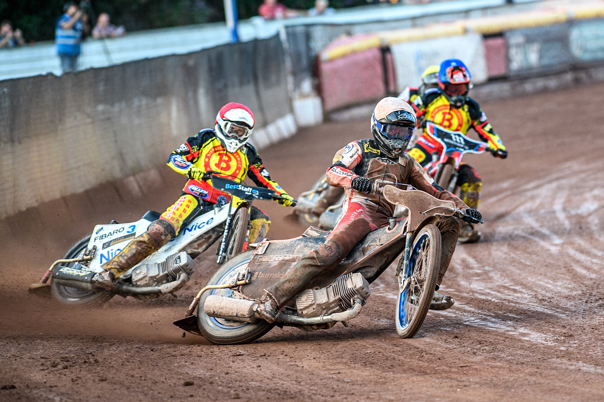 Belle Vue Aces' Brady Kurtz in White leading Birmingham Brummies' Wiktor Lampart in Red, Birmingham Brummies' Zach Cook in Blue and Belle Vue Aces' Norick Blodorn in Yellow during the Rowe Motor Oil Premiership match between Birmingham Brummies and Belle Vue Aces at Perry Bar Stadium, Birmingham on Monday 29th July 2024. (Photo: Ian Charles | MI News)