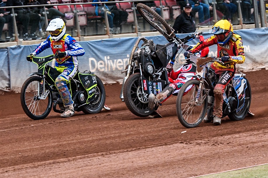 Belle Vue Colts' Billy Budd rears at the start between Leicester Lion Cubs' Guest Rider Darryl Ritchings in White and Leicester Lion Cubs' Sonny Springer in Yellow during the WSRA National Development League match between Belle Vue Colts and Leicester Lion Cubs at the National Speedway Stadium, Manchester on Friday 18th April 2025. (Photo: Ian Charles | MI News)