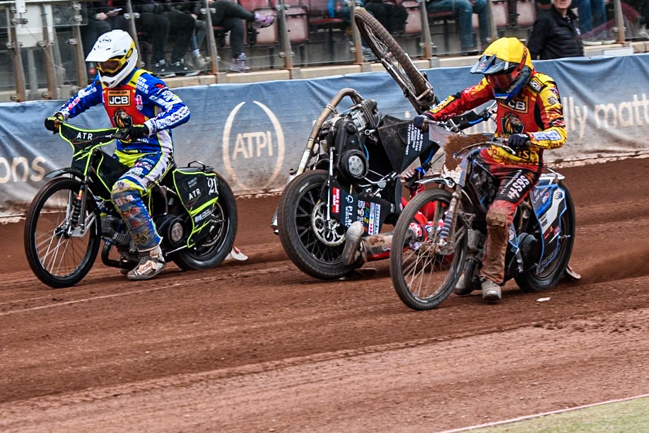 Belle Vue Colts' Billy Budd rears at the start between Leicester Lion Cubs' Guest Rider Darryl Ritchings in White and Leicester Lion Cubs' Sonny Springer in Yellow during the WSRA National Development League match between Belle Vue Colts and Leicester Lion Cubs at the National Speedway Stadium, Manchester on Friday 18th April 2025. (Photo: Ian Charles | MI News)