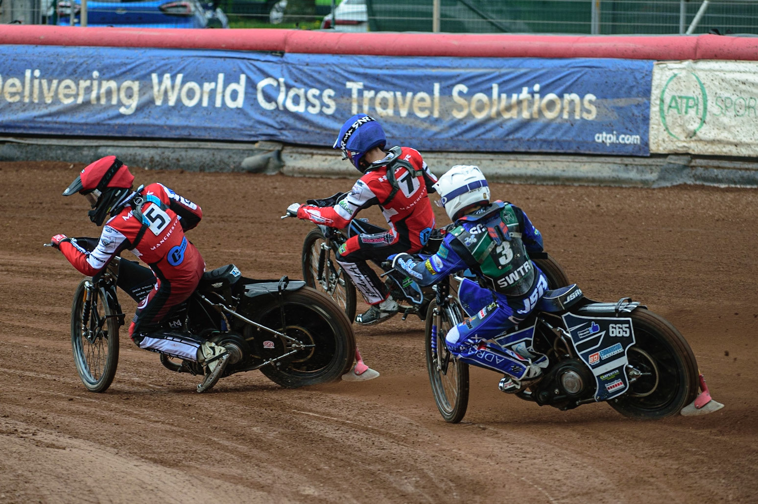 MANCHESTER, UK. APR 15TH  Jody Scott  (White) chases Harry McGurk  (Red) and Freddy Hodder (Blue)  during the National Development League match between Belle Vue Colts and Plymouth Centurions at the National Speedway Stadium, Manchester on Friday 15th April 2022. (Credit: Ian Charles | MI News)