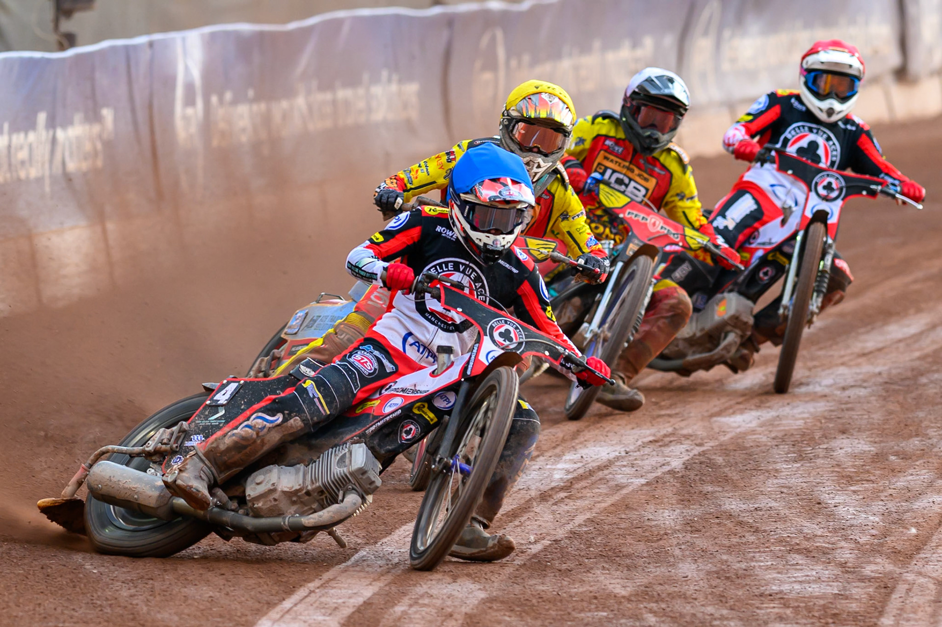 Zach Cook of Belle Vue Aces in Blue leading Drew Kemp of Leicester Lions in Yellow ,Ryan Douglas of Leicester Lions in White and Peter Kildemand of Belle Vue Aces in Red during the Rowe Motor Oil Premiership match between Belle Vue Aces and Leicester Lions at the National Speedway Stadium, Manchester on Monday 3rd August 2026. (Photo: Ian Charles | MI News)