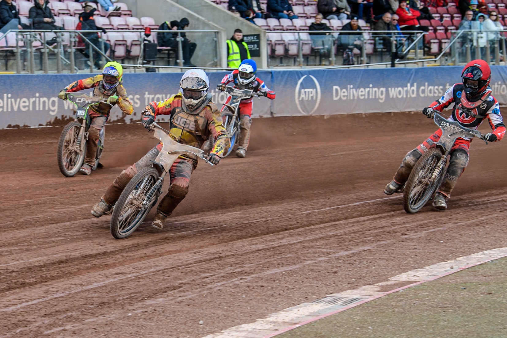 Leicester Lion Cubs' Joe Thompson (White) leads  Leicester Lion Cubs' Vinnie Foord (Yellow), Belle Vue Colts' Freddy Hodder (Red) and Belle Vue Colts' Jack Shimelt (Blue) during the WSRA National Development League match between Belle Vue Colts and Leicester Lion Cubs at the National Speedway Stadium, Manchester on Friday 29th March 2024. (Photo: Ian Charles | MI News)