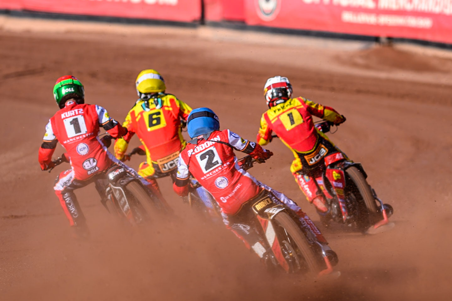 Belle Vue Aces' Norick Blödorn in Blue chases Leicester Lions' Max Fricke  in White, Leicester Lions' Drew Kemp  in Yellow and Belle Vue Aces' Brady Kurtz in Red during the Rowe Motor Oil Premiership match between Belle Vue Aces and Leicester Lions at the National Speedway Stadium, Manchester on Monday 14th July 2025. (Photo: Ian Charles | MI News)