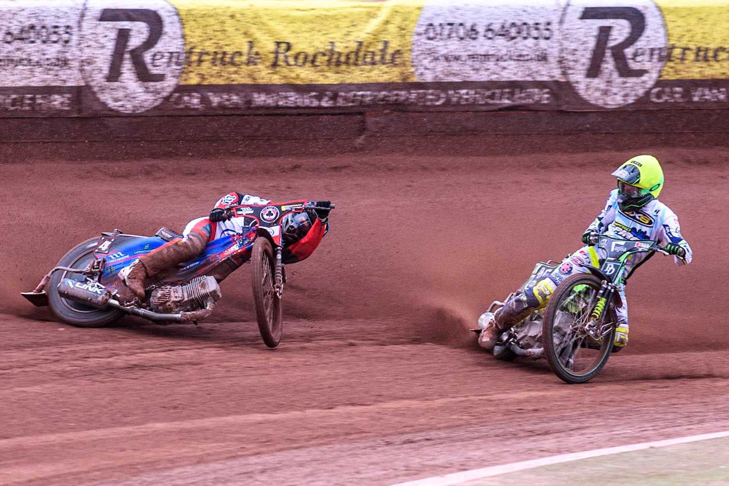 Belle Vue Aces' Ben Cook in Blue loses control after a tangle with Oxford Spires' Charles Wright in Yellow during the Rowe Motor Oil Premiership match between Belle Vue Aces and Oxford Spires at the National Speedway Stadium, Manchester on Monday 22nd July 2024. (Photo: Ian Charles | MI News)