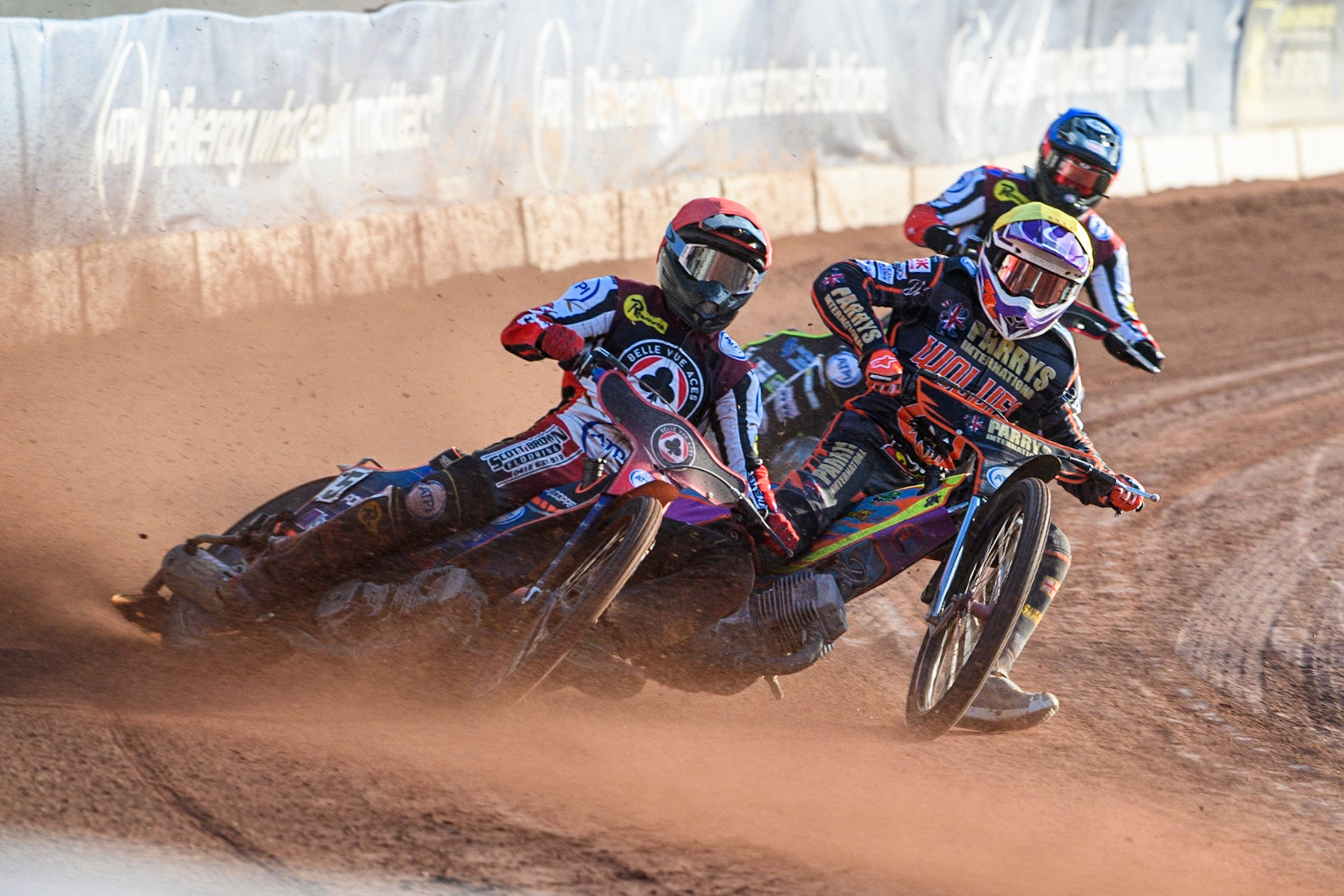 Brady Kurtz (Red) outside Rory Schlein (Yellow) with Tom Brennan (Blue) behind during the Sports Insure Premiership match between Belle Vue Aces and Wolverhampton Wolves at the National Speedway Stadium, Manchester on Monday 3rd July 2023. (Photo: Ian Charles | MI News)