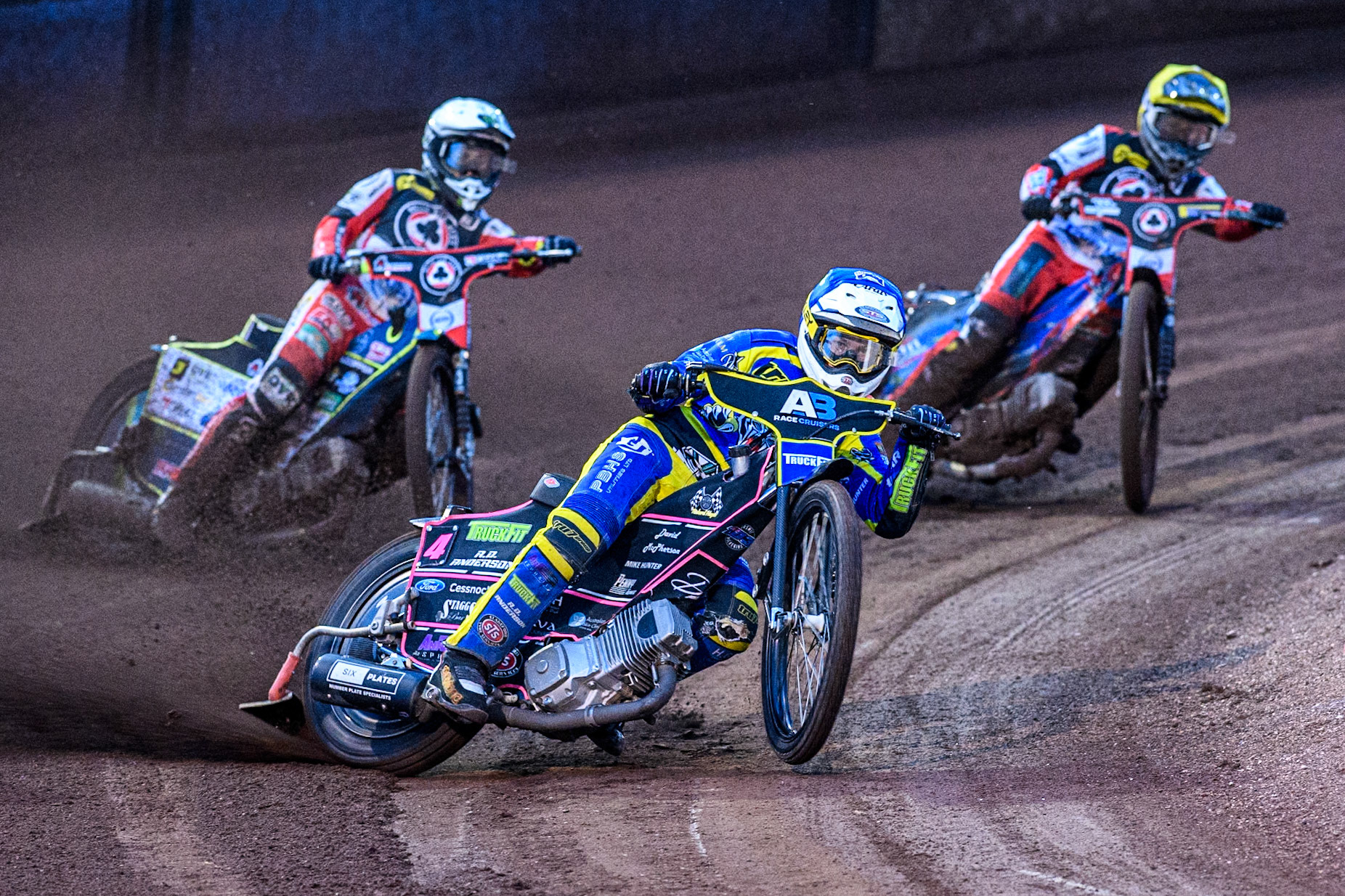 Sheffield Tigers' Josh Pickering  in Blue leading Belle Vue Aces' Jaimon Lidsey  in White and Belle Vue Aces' Ben Cook  in Yellow during the Rowe Motor Oil Premiership match between Sheffield Tigers and Belle Vue Aces at Owlerton Stadium, Sheffield on Monday 26th August 2024. (Photo: Ian Charles | MI News)