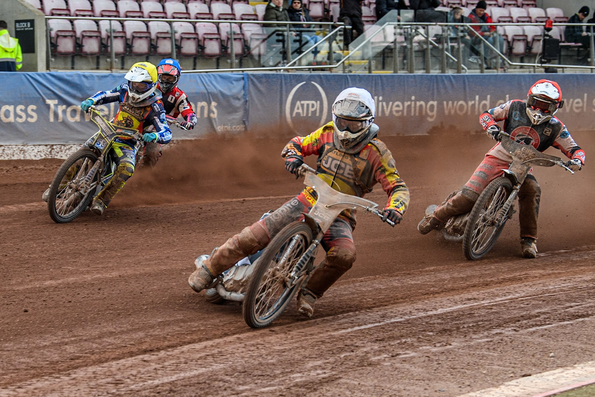 Leicester Lion Cubs' Joe Thompson (White) and team mate Jody Scott lead Belle Vue Colts' Chad Wirtzfeld (Red) and Belle Vue Colts' Ben Trigger  (Blue) during the WSRA National Development League match between Belle Vue Colts and Leicester Lion Cubs at the National Speedway Stadium, Manchester on Friday 29th March 2024. (Photo: Ian Charles | MI News)