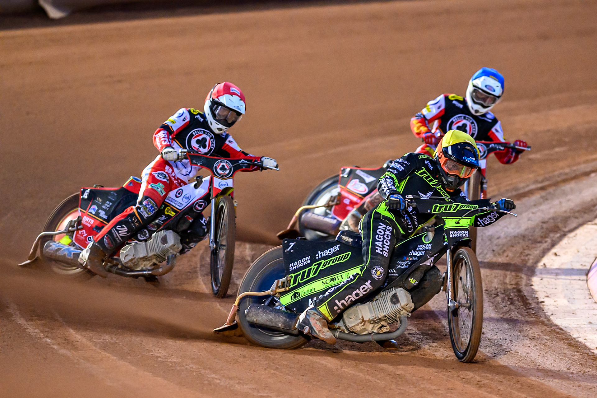 Jason Edwards of Ipswich Witches  in Yellow leading Tate Zischke of Belle Vue Aces  in Red and Jake Mulford of Belle Vue Aces  in Blue during the Rowe Motor Oil Premiership Play Off Semi Final 1 (1st Leg)  between Belle Vue Aces and Ipswich Witches at the National Speedway Stadium, Manchester on Monday 8th September 2025. (Photo: Ian Charles | MI News)