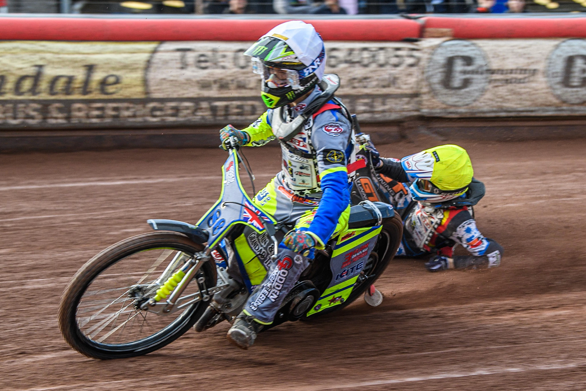 Sonny Springer (White) collides with Billy Budd (Yellow) and causes Budd to fall during the British Youth Speedway Championships at the National Speedway Stadium, Manchester on Friday 21st July 2023. (Photo: Ian Charles | MI News)