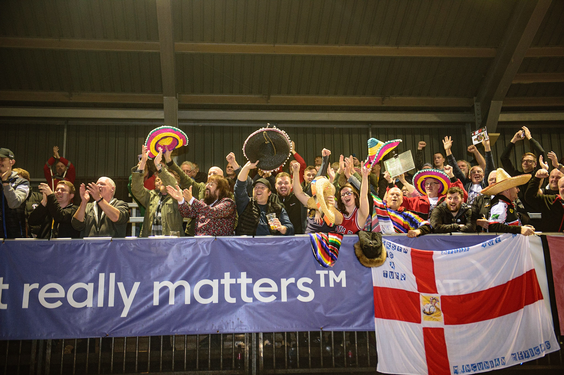 MANCHESTER, UK. OCT 7TH  Belle Vue BikeRight Aces  fans celebrate during the SGB Premiership Play off Semi-Final Second Leg between Belle Vue Aces and Sheffield Tigers at the National Speedway Stadium, Manchester on Thursday 7th October 2021. (Credit: Ian Charles | MI News)