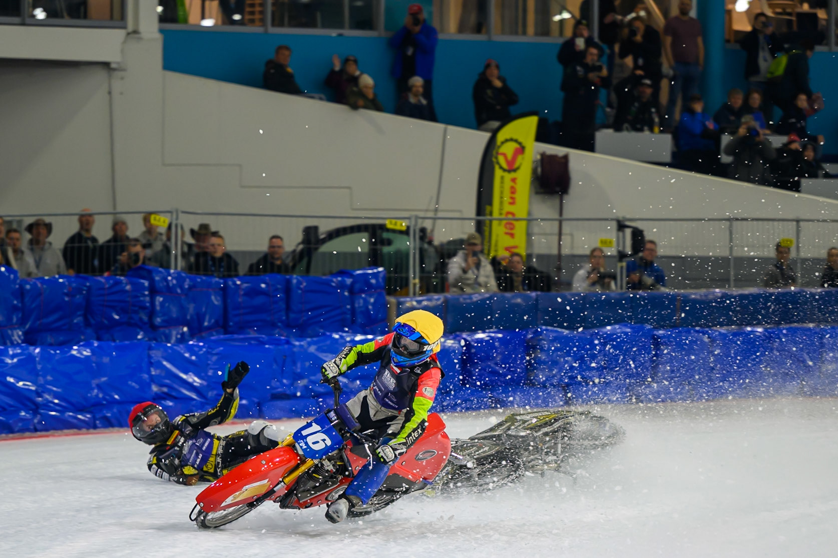 Heikki Huusko (67) of Finland  collides with Wild Card Harald Simon (16) of Austria in Yellow in the first turn during the FIM Ice Speedway Gladiators World Championship Final 3 at Ice Rink Thialf, Heerenveen on Saturday 11th April 2026. (Photo: Ian Charles | MI News)