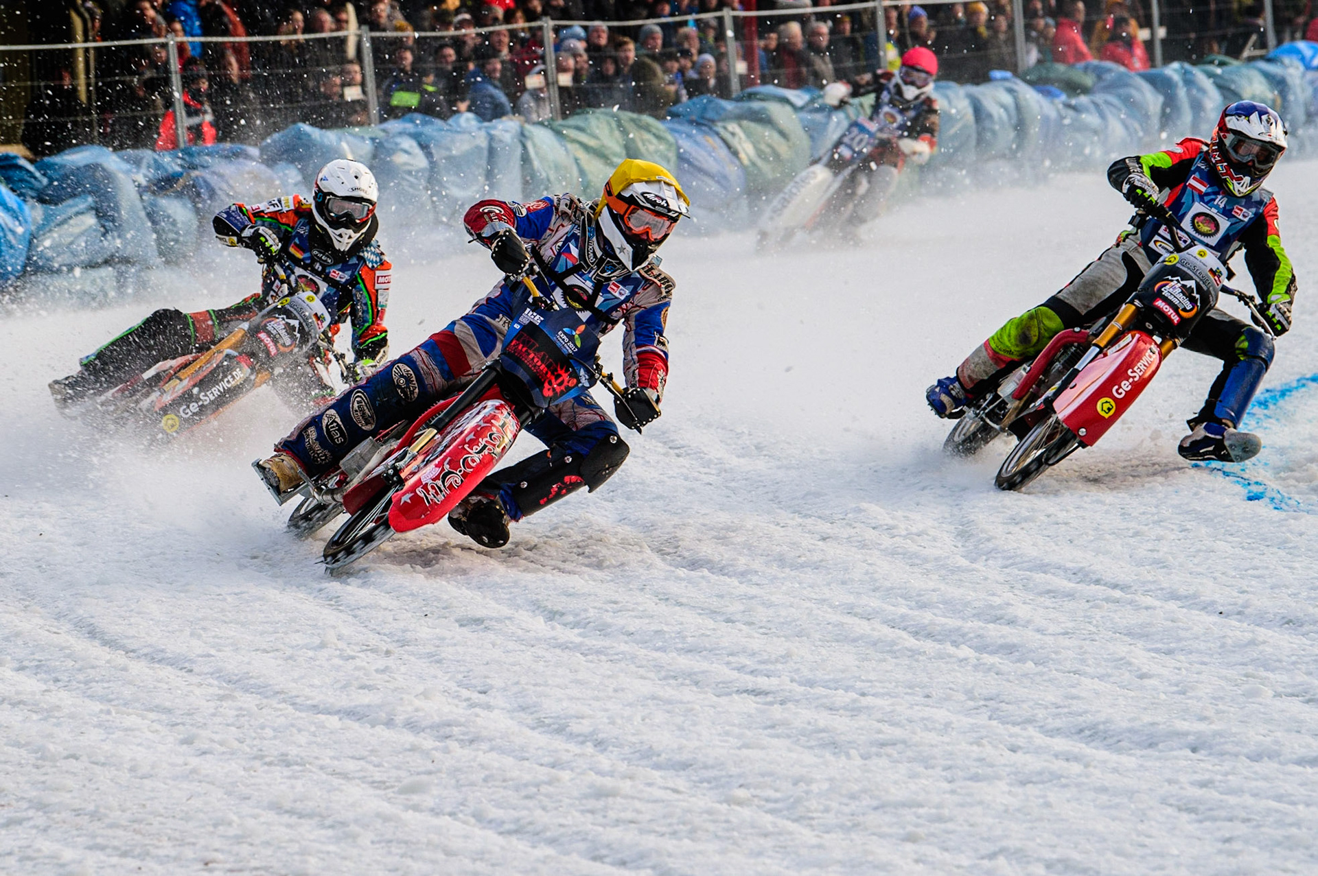 Jan Klatovsky (Yellow) outside Harald Simon (Blue) with Markus Jell (White) and Artturi Ervasti (Red) during the German Individual Ice Speedway Championship at Horst-Dohm-Eisstadion, Berlin on Friday 3rd March 2023. (Photo: Ian Charles | MI News)