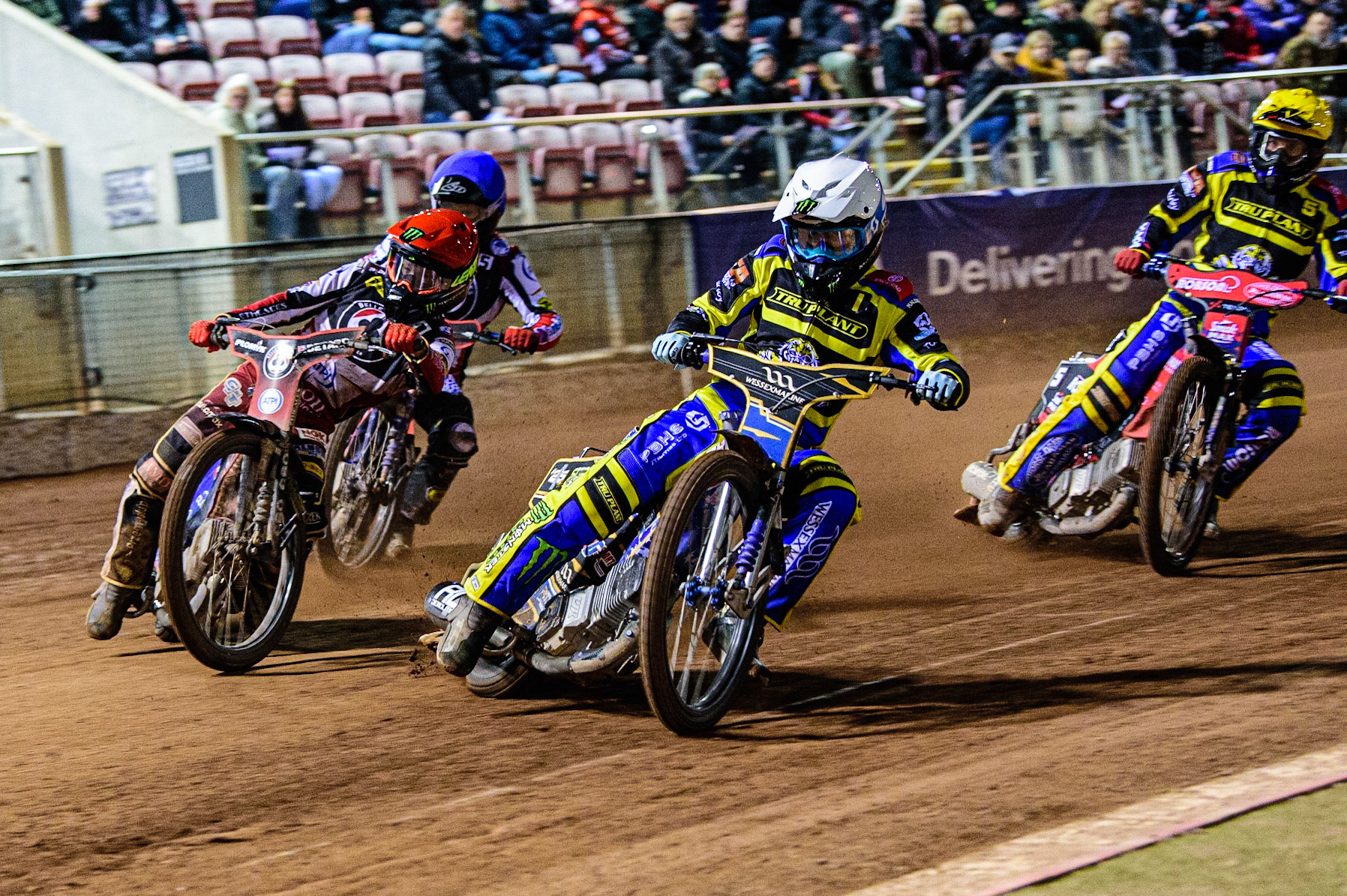 Jack Holder  (White) inside Dan Bewley  (Red) with Brady Kurtz  (Blue) and Tobiasz Musielak  (Yellow) behind during the SGB Premiership match between Belle Vue Aces and Sheffield Tigers at the National Speedway Stadium, Manchester on Monday 27th March 2023. (Photo: Ian Charles | MI News)