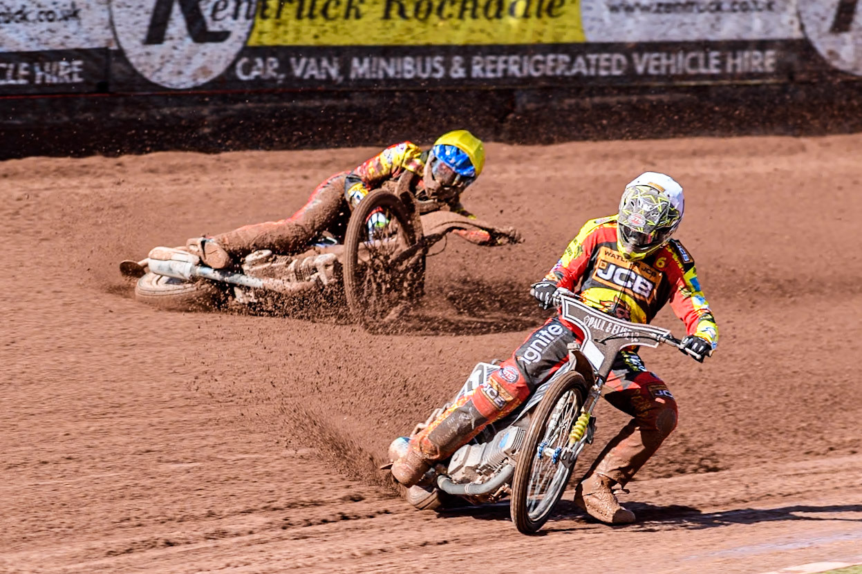 Leicester Lion Cubs' Sonny Springer  (Yellow) falls behind team mate Leicester Lion Cubs' Luke Crang (White) during the WSRA  National Development League match between Belle Vue Colts and Leicester Lion Cubs at the National Speedway Stadium, Manchester on Friday 29th March 2024. (Photo: Ian Charles | MI News)