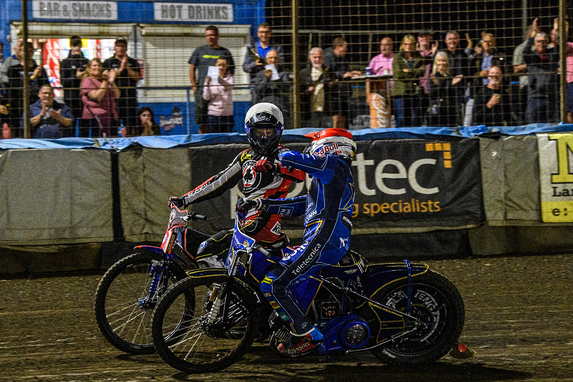 Robert Lambert  (Red) congratulates Brady Kurtz  on his heat win after a hard fought heat during the Sports Insure Premiership match between King's Lynn Stars and Belle Vue Aces at the Adrian Flux Arena, King's Lynn on Thursday 24th August 2023. (Photo: Ian Charles | MI News)