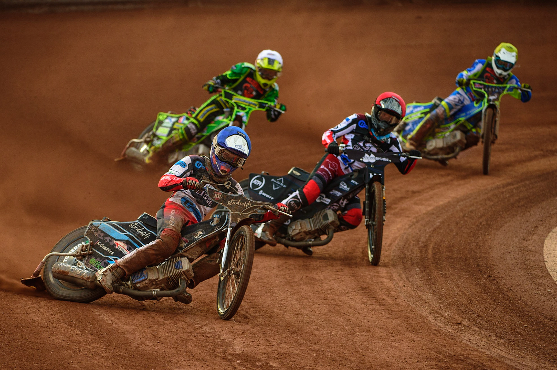 Freddy Hodder  (Blue) leads Harry McGurk  (Red) Sam Bebee  (White) and Luke Muff  (Yellow) during the National Development League match between Belle Vue Colts and Mildenhall Fens Tigers at the National Speedway Stadium, Manchester on Friday 15th July 2022. (Credit: Ian Charles | MI News)