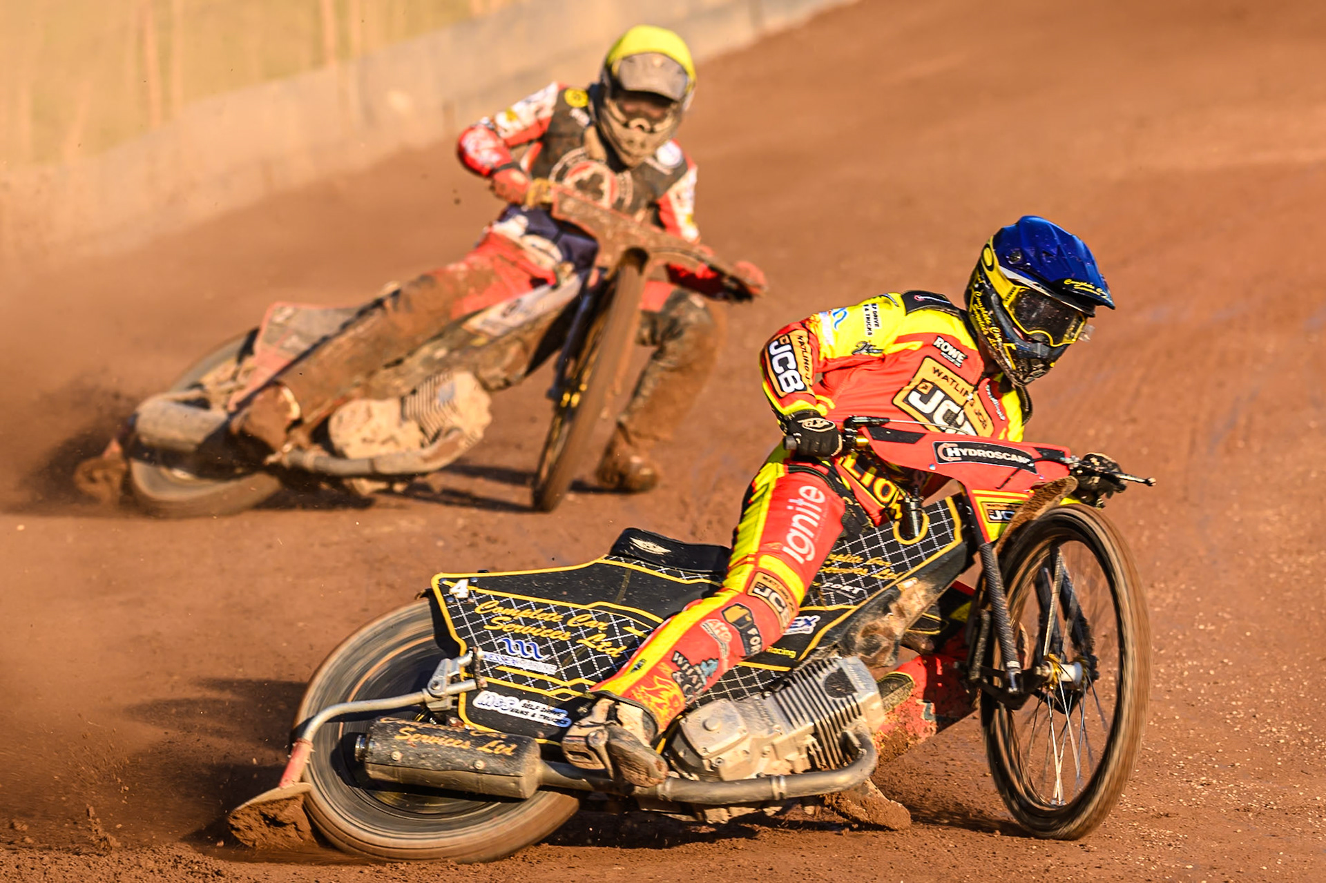 Leicester Lions' Kyle Howarth in Blue leading Belle Vue Aces' Norick Blodorn in Yellow during the Rowe Motor Oil Premiership match between Leicester Lions and Belle Vue Aces at the Hydroscand Arena, Leicester on Thursday 19th June 2025. (Photo: Ian Charles | MI News)