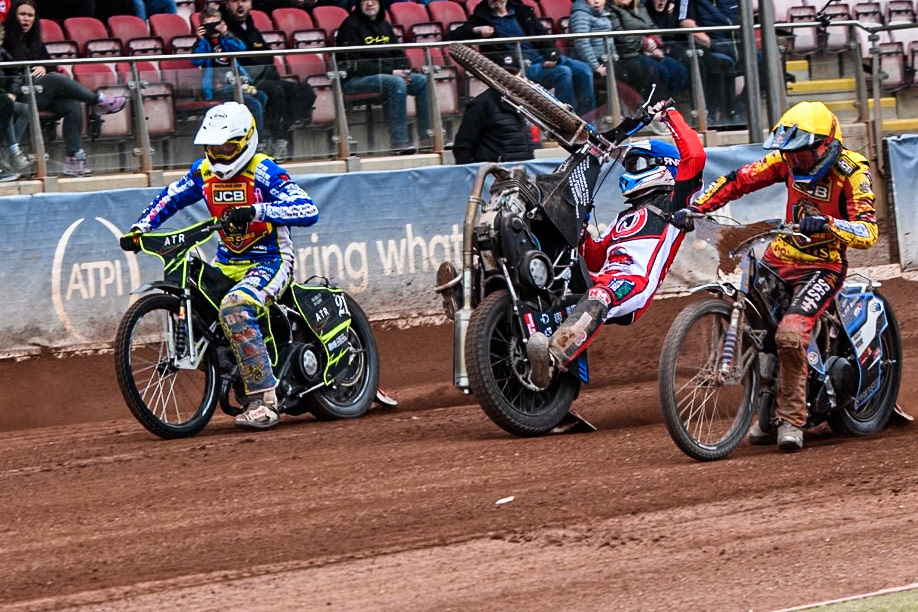 Belle Vue Colts' Billy Budd rears at the start between Leicester Lion Cubs' Guest Rider Darryl Ritchings in White and Leicester Lion Cubs' Sonny Springer in Yellow during the WSRA National Development League match between Belle Vue Colts and Leicester Lion Cubs at the National Speedway Stadium, Manchester on Friday 18th April 2025. (Photo: Ian Charles | MI News)