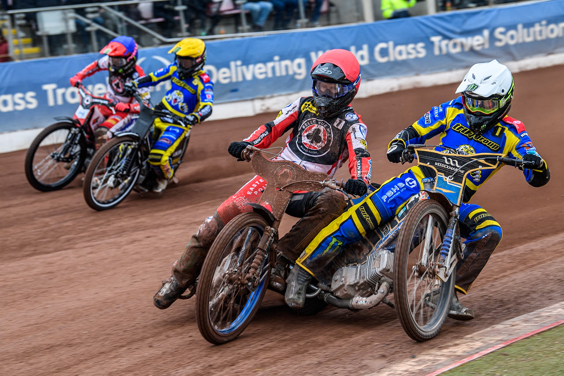 Sheffield Tigers' Jack Holder (White) inside Belle Vue ATPI Aces Brady Kurtz (Red) with Sheffield Tigers' Tai Woffinden (Yellow) and Belle Vue ATPI Aces Jaimon Lidsey (Red) behind during the Rowe Motor Oil Premiership KO Cup Quarter Final 1st Leg between Belle Vue Aces and Sheffield Tigers at the National Speedway Stadium, Manchester on Monday 1st April 2024. (Photo: Ian Charles | MI News)