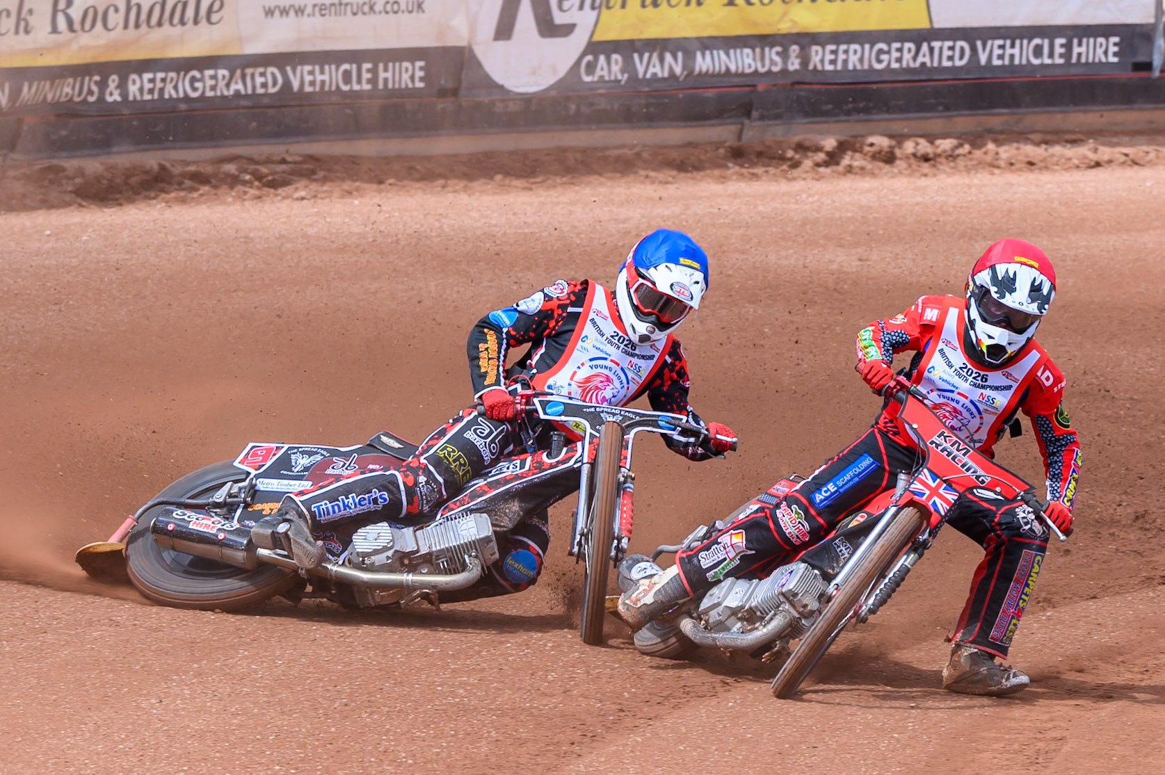BRITISH YOUTH CHAMPIONSHIP (500cc): Kayden Mundy (8) in Red rides inside Dylan Huthwaite (9)  in Blue who then falls during the British Youth Speedway Championship at the National Speedway Stadium, Manchester on Sunday 10th May 2026. (Photo: Ian Charles | MI News)