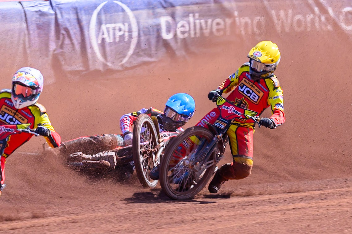 Kyle Howarth of Leicester Lions  in Yellow brings down Tate Zischke of Belle Vue Aces in Blue during the Knockout Cup Northern Section match between Belle Vue Aces and Leicester Lions at the National Speedway Stadium, Manchester on Monday 6th April 2026. (Photo: Ian Charles | MI News)