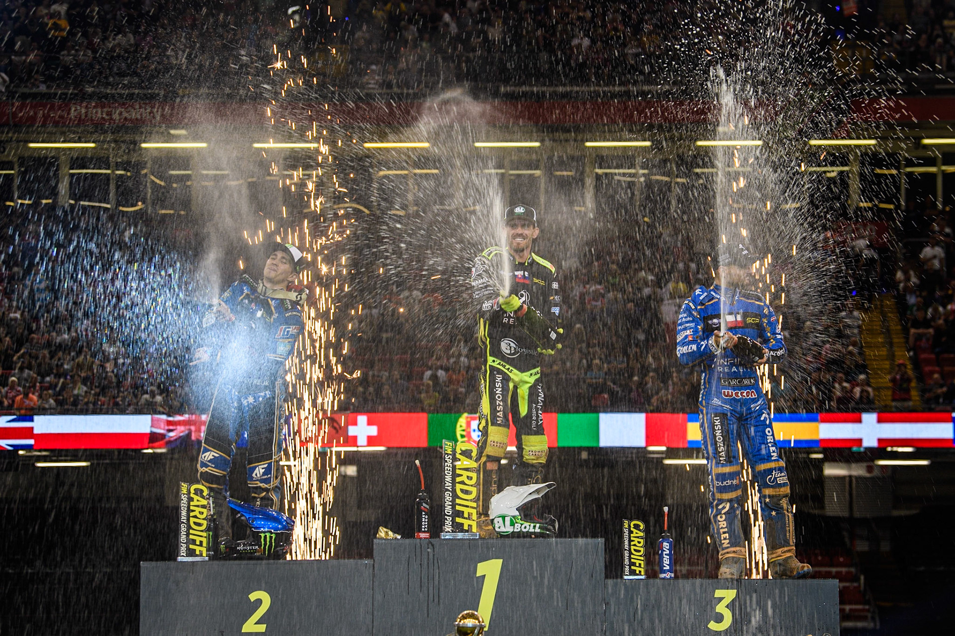 The Champagne is sprayed liberally by the Top 3 during the FIM Speedway Grand Prix of Great Britain at the Principality Stadium, Cardiff on Saturday 2nd September 2023. (Photo: Ian Charles | MI News)