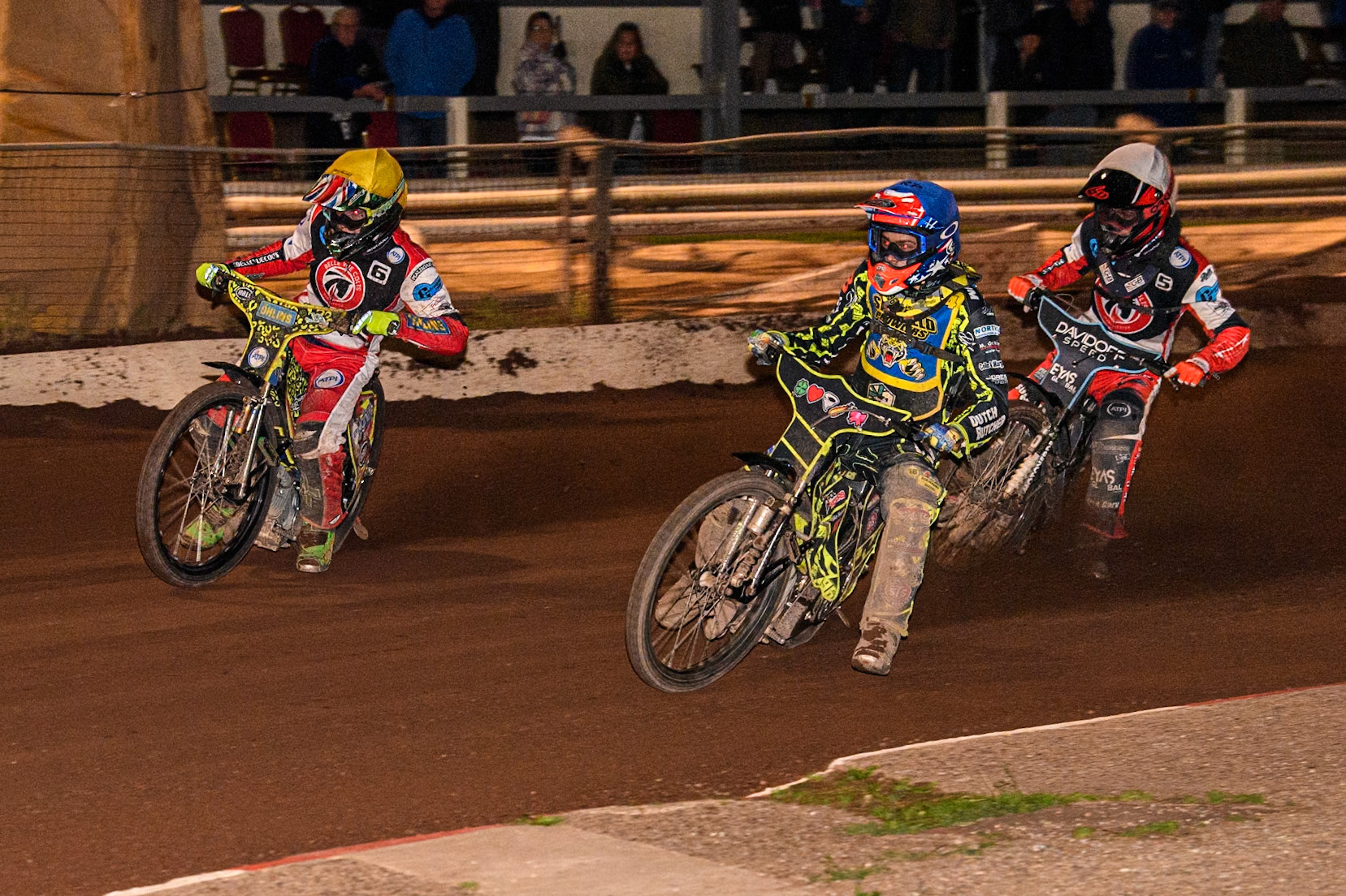 Sheffield Tiger Cubs' Ace Pijper  in Blue rides inside Belle Vue Colts' William Cairns  in Yellow with Belle Vue Colts' Freddy Hodder  in White behind during the WSRA National Development League match between Sheffield Tiger Cubs and Belle Vue Colts at Owlerton Stadium, Sheffield on Thursday 12th September 2024. (Photo: Ian Charles | MI News)