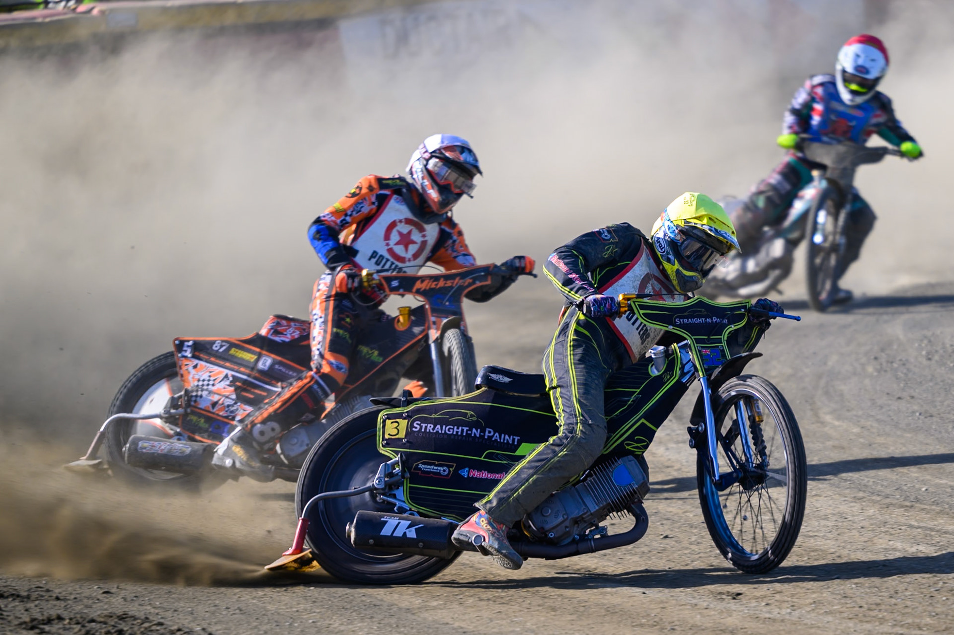 Ben Whalley of Stoke Potters in Yellow leading Mickie Simpson of Stoke Potters in White and Alfie Bowtell of Buxton Bulls in Red during the National Development League Challenge match between Buxton Bulls and Stoke Potters at Hi-Edge Speedway, Buxton on Sunday 24th May 2026. (Photo: Ian Charles | MI News)