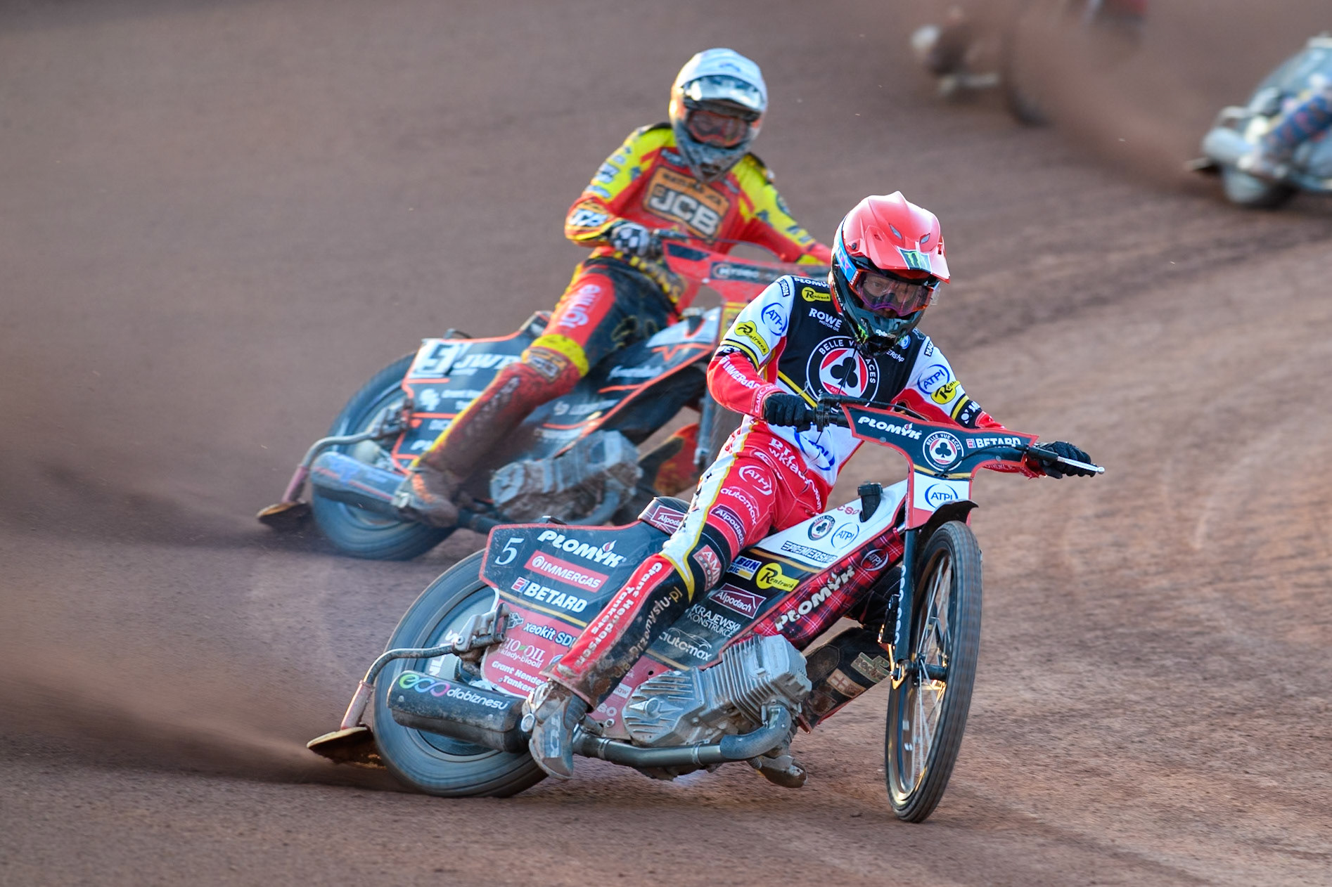 Belle Vue Aces' Dan Bewley in Red leading Leicester Lions' Sam Masters in White during the Rowe Motor Oil Premiership match between Belle Vue Aces and Leicester Lions at the National Speedway Stadium, Manchester on Monday 19th May 2025. (Photo: Ian Charles | MI News)