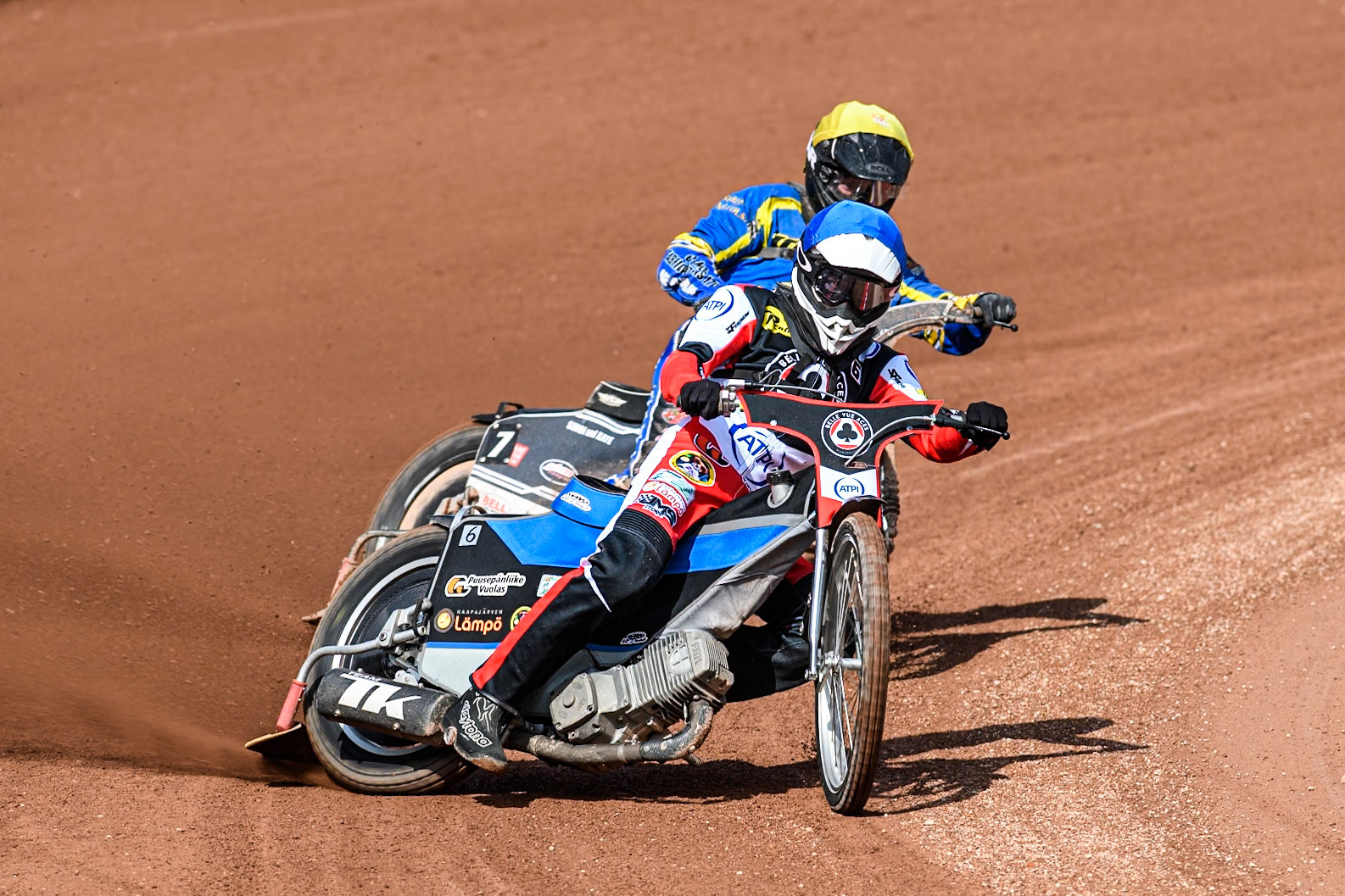 Belle Vue Aces' Antti Vuolas  in Blue leading Sheffield Tigers' Guest Rider Joe Thompson  in Yellow during the Rowe Motor Oil Premiership match between Belle Vue Aces and Sheffield Tigers at the National Speedway Stadium, Manchester on Monday 26th August 2024. (Photo: Ian Charles | MI News)