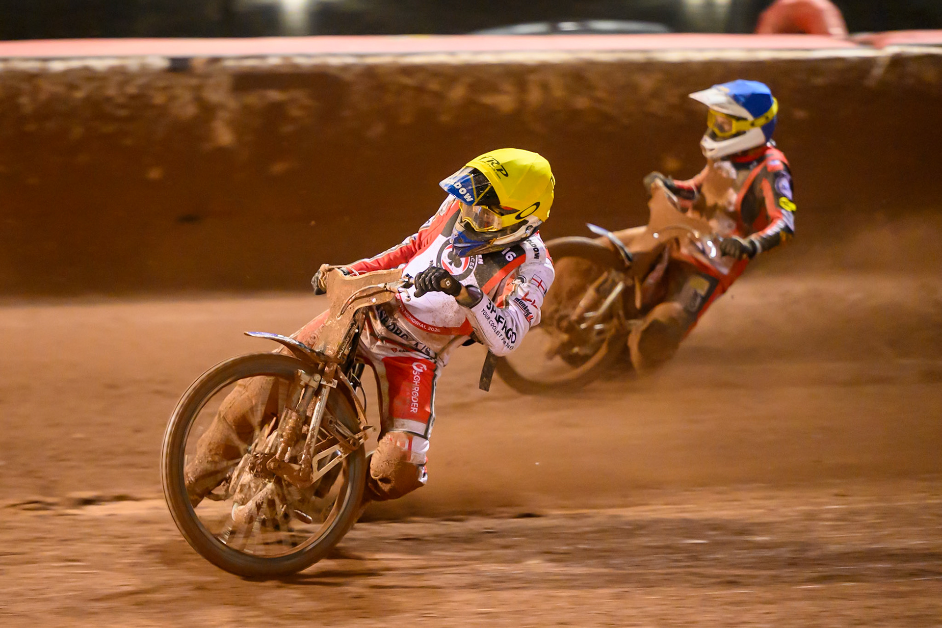 Rasmus Jensen in Yellow rides inside Peter Kildemand  in Blue during the Peter Craven Memorial Trophy at the National Speedway Stadium, Manchester, on Monday 16th March 2026. (Photo: Ian Charles | MI News)