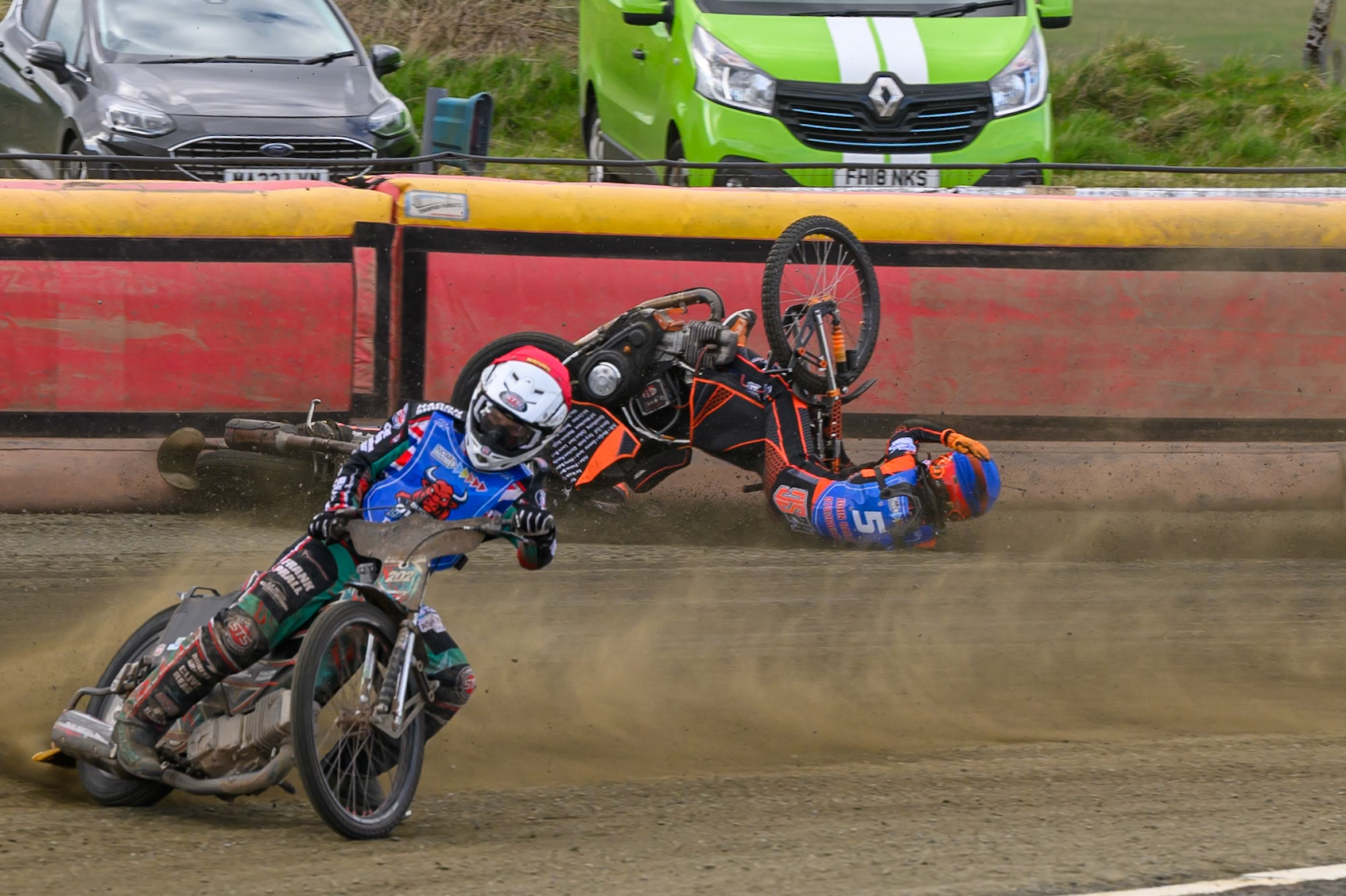 Connor Coles of NDL Nomads   in White fall and Jack Smith of Buxton Bulls   in Blue collides with him during the  Challenge match between Buxton Bulls and NDL Nomads at Hi-Edge Speedway, Buxton on Sunday 19th April 2026. (Photo: Ian Charles | MI News)