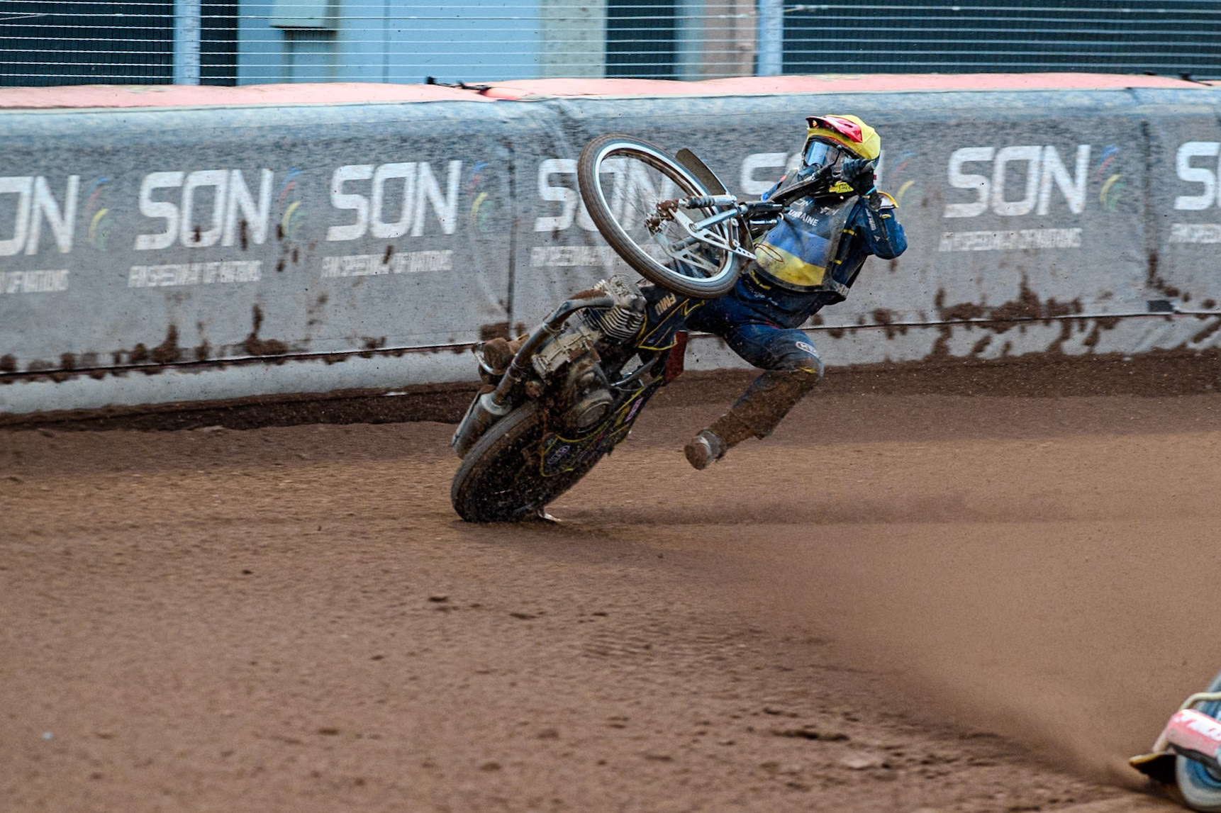 Marko Levishyn of Ukraine in Yellow crashes out of his final heat during the Monster Energy FIM Speedway of Nations Semi-Final 1 at the National Speedway Stadium, Manchester on Tuesday 9th July 2024. (Photo: Ian Charles | MI News)