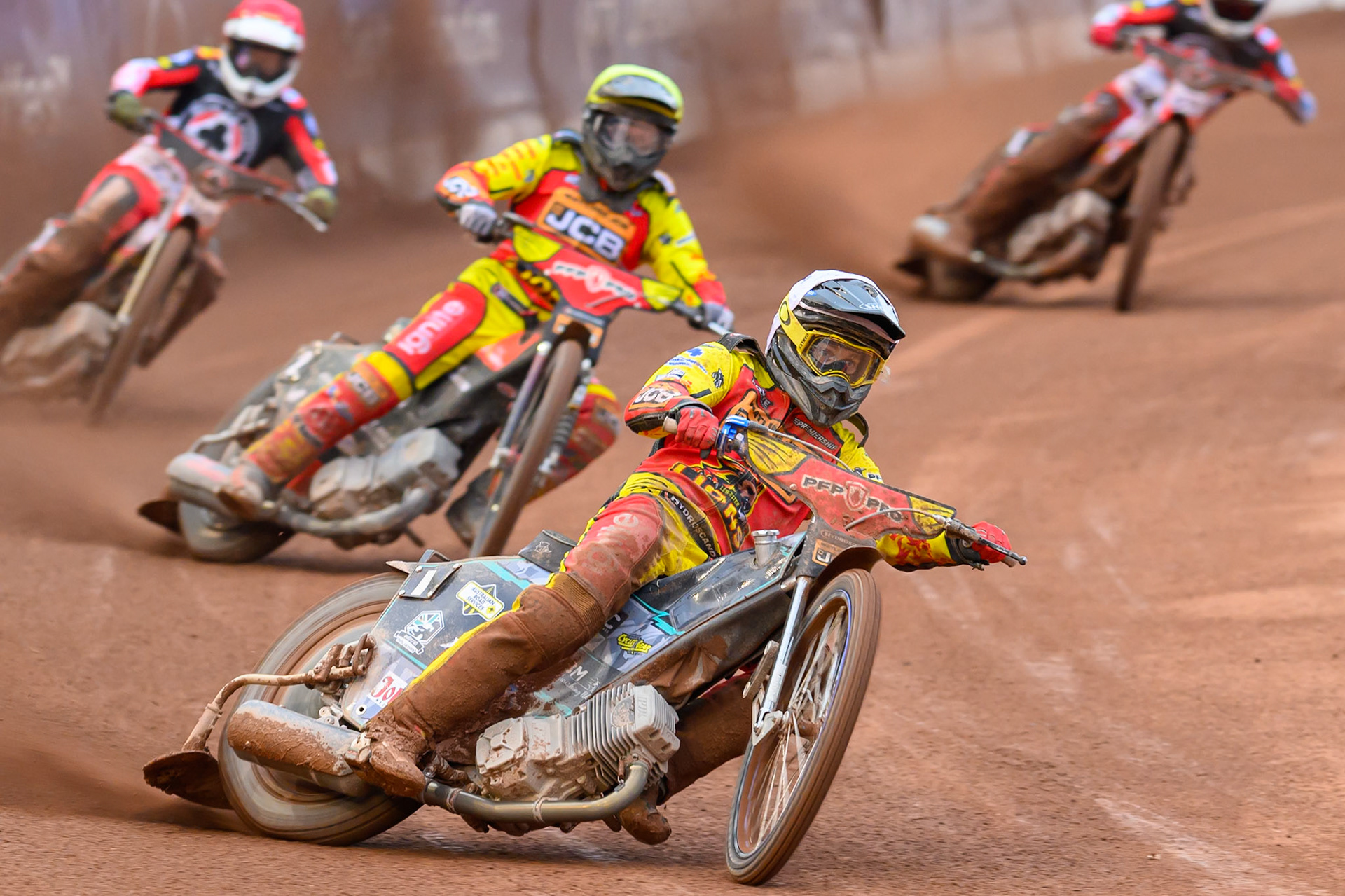 Ryan Douglas of Leicester Lions in White leading Dan Thompson of Leicester Lions in Yellow and Peter Kildemand of Belle Vue Aces in Red during the Rowe Motor Oil Premiership match between Belle Vue Aces and Leicester Lions at the National Speedway Stadium, Manchester on Monday 15th June 2026. (Photo: Ian Charles | MI News)