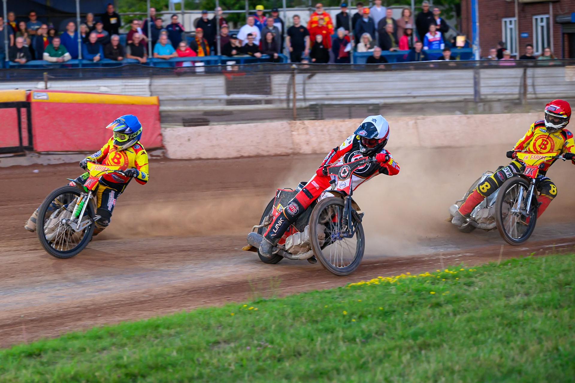 Birmingham Brummies' Ben Barker  in Blue leading Belle Vue Aces' Zach Cook and Birmingham Brummies' Keynan Rew  in Red  during the Rowe Motor Oil Premiership match between Birmingham Brummies and Belle Vue Aces at Perry Barr Stadium, Birmingham on Monday 28th July 2025. (Photo: Ian Charles | MI News)